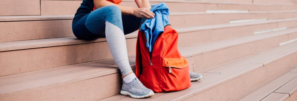 best backpacks for the gym - girl in gym gear with backpack