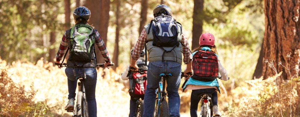 pack a backpack for cycling - group of cyclists with backpacks
